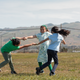 Holland, center, plays with friends on the athletic fields of Donald J. Meyer Elementary School.